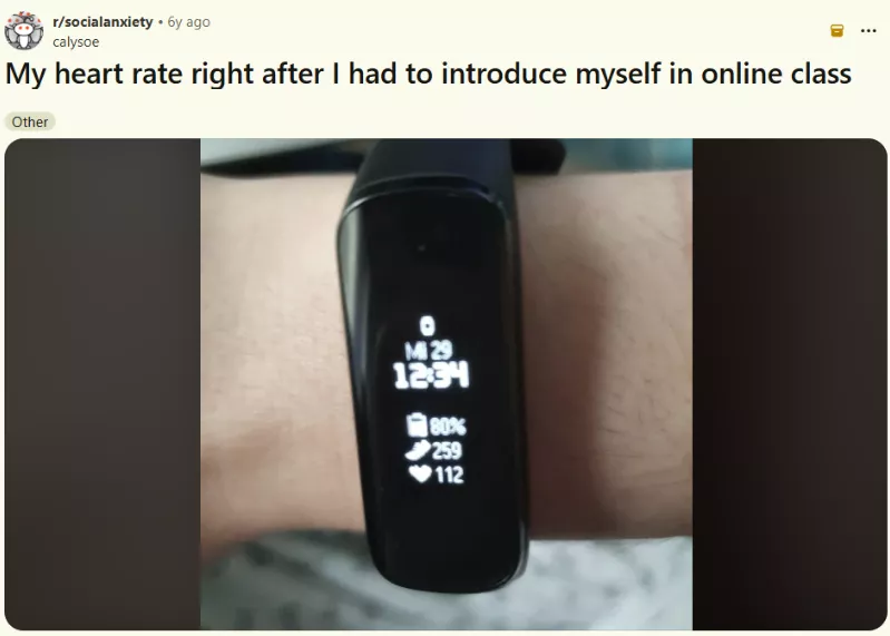 A Reddit post from r/socialanxiety showing a smartwatch displaying a heart rate of 112 bpm 