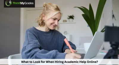 Student reviewing notes while hiring academic help online for coursework support and success